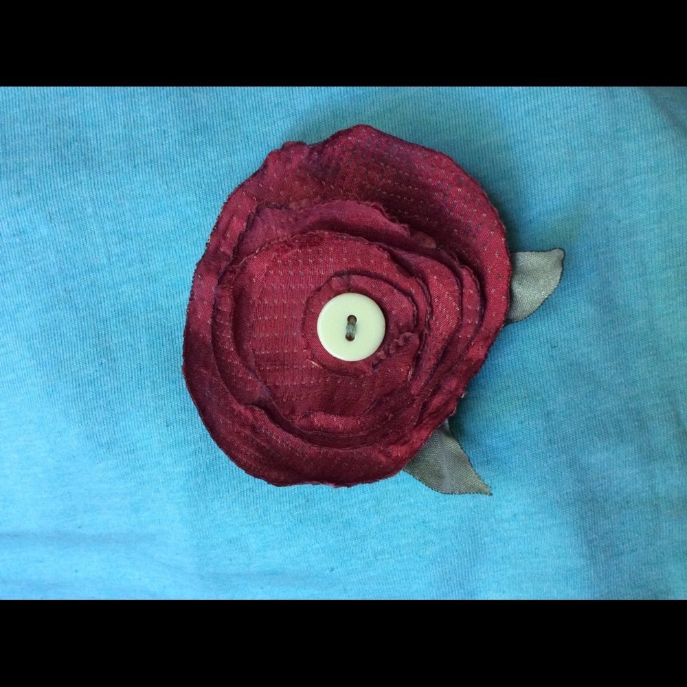 Handmade cloth rose pin. Recycling at its best!